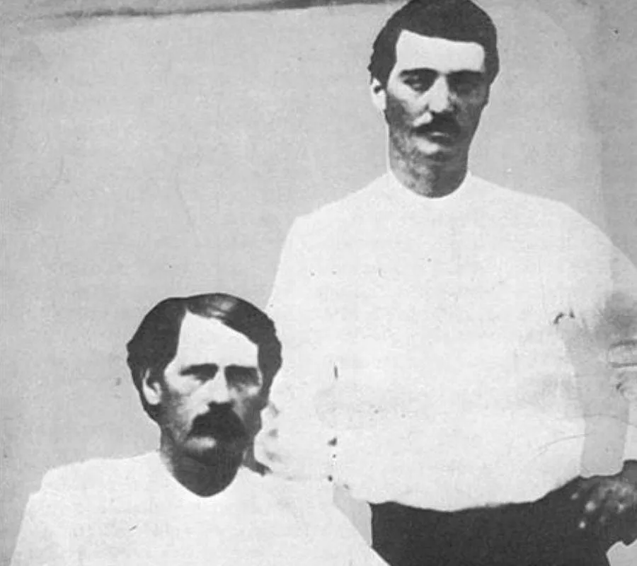 Wyatt Earp and Bat Masterson posing for a picture together