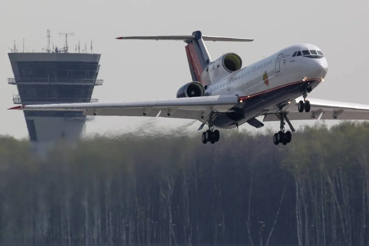 The Yakovlev Yak-42 takes off from an airport.