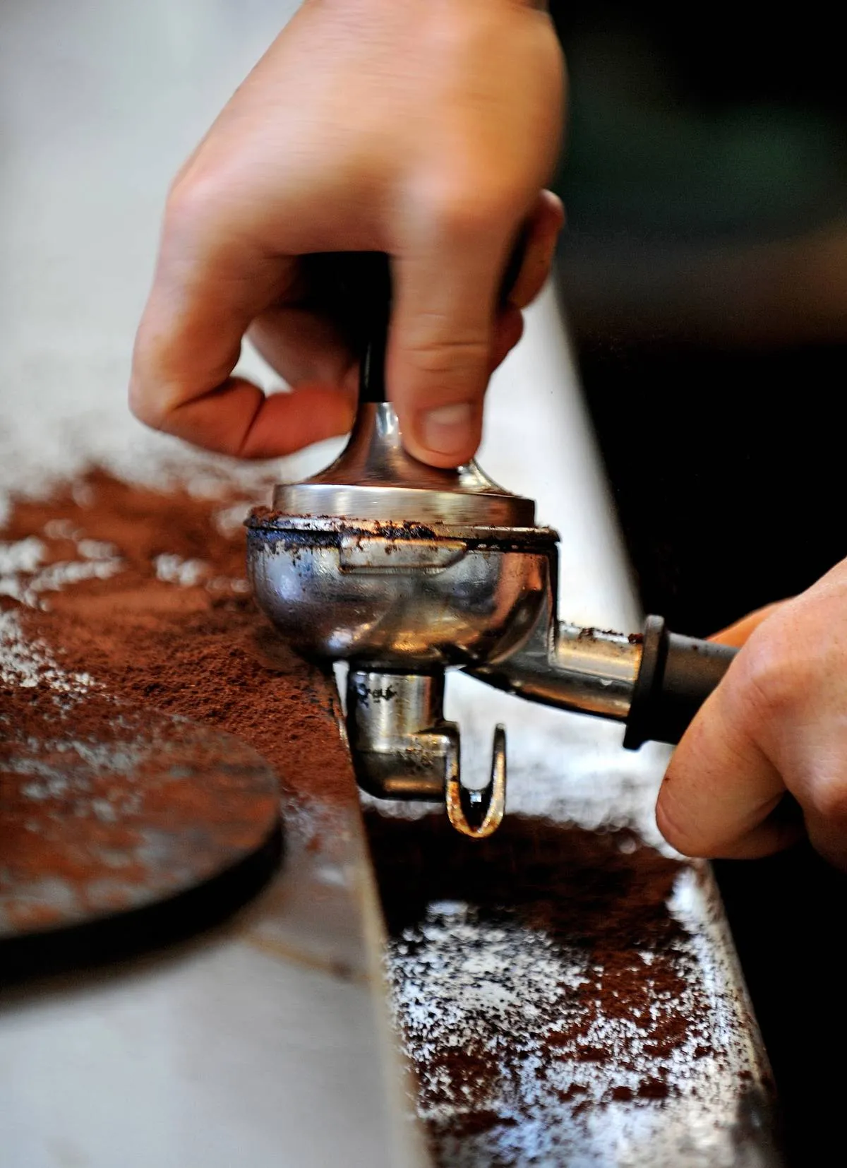 A tamper (C) is used to prepare coffee g
