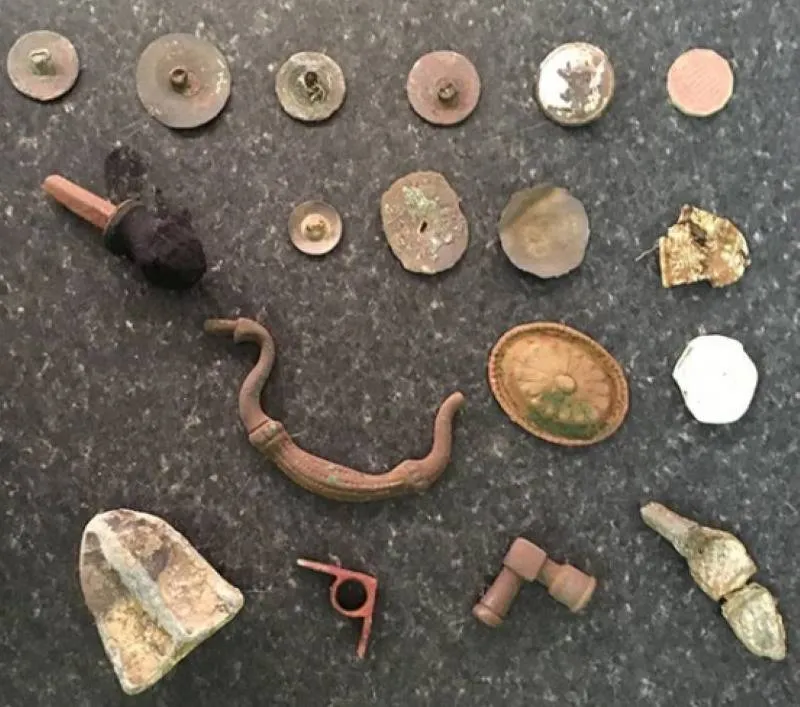 various artifacts from the iron age scattered on the ground