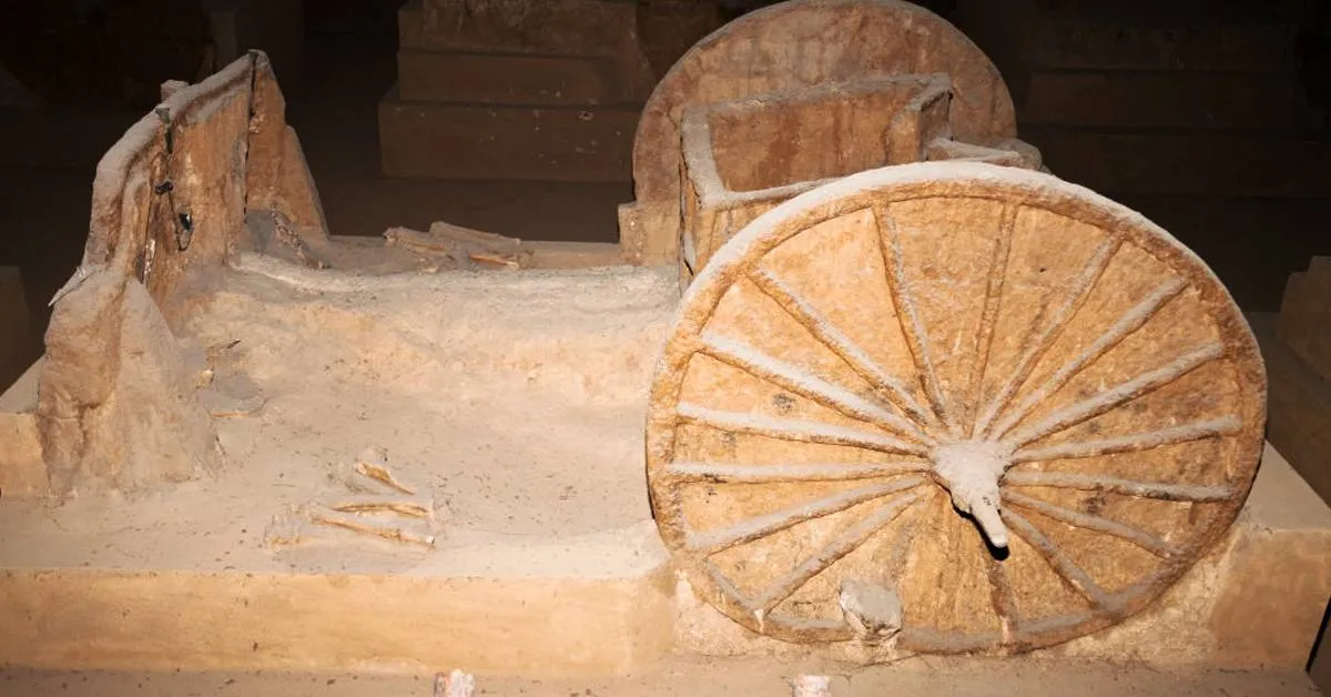 chariot wheels covered  in dirt