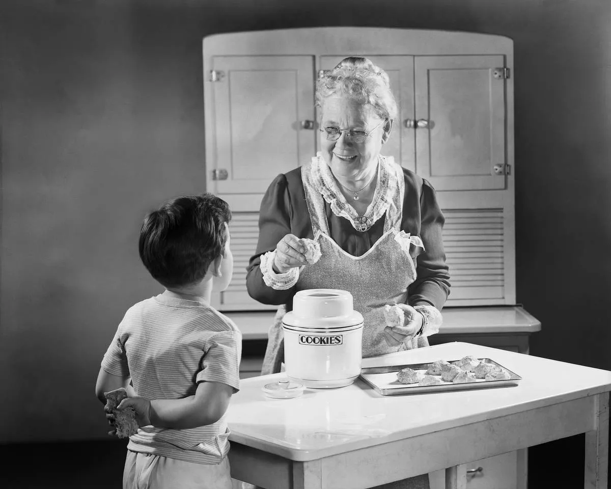 Grandmotherly Woman Making Cookies for a Boy