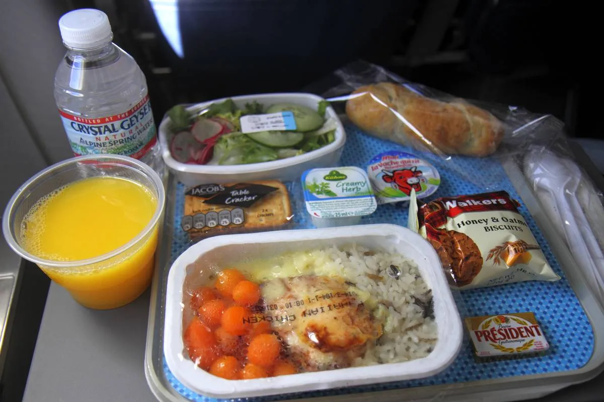 Paris, Charles de Gaulle Airport American Airlines economy seat in-flight meal orange juice