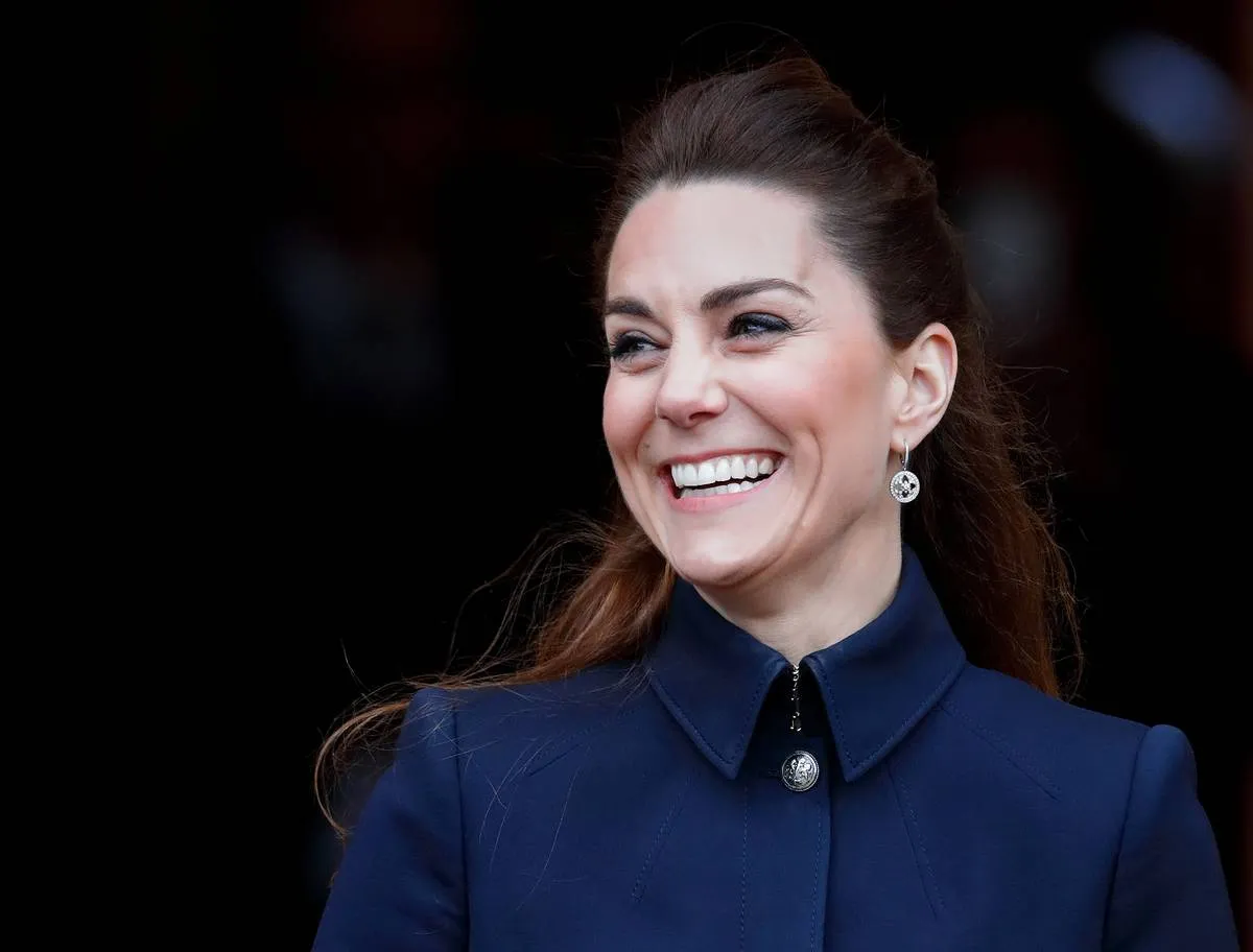 A close-up shows Kate Middleton's earrings matching her broach. 