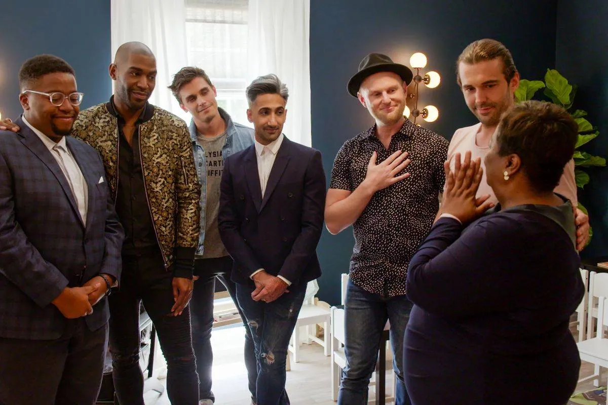 queer eye men with their guests on the show