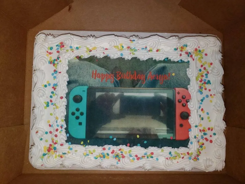 a cake maker put the example picture of a switch on a cake