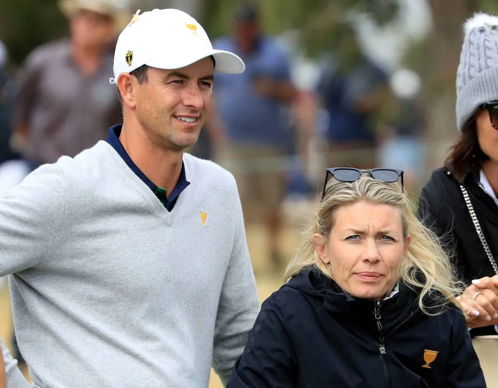 Adam Scott of the International watcheds the later matches with his wife Marie Kojzar