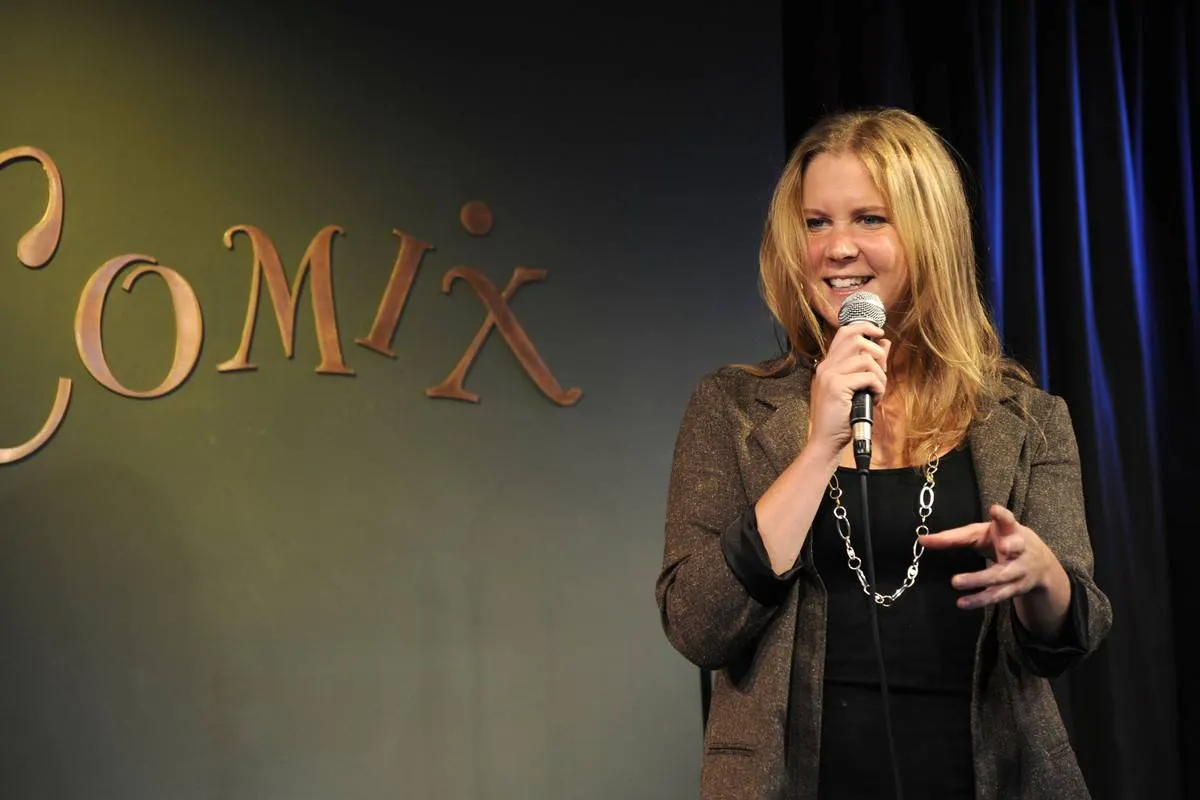Amy Schumer performs onstage.