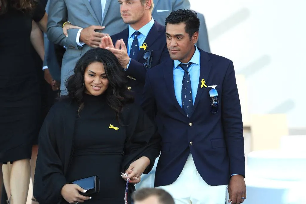 Tony Finau of the United States and wife Alayna Finau depart the opening ceremony
