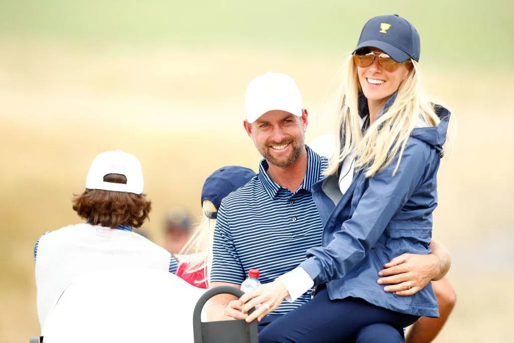 Webb Simpson of the United States team and wife Taylor Simpson ride in a cart