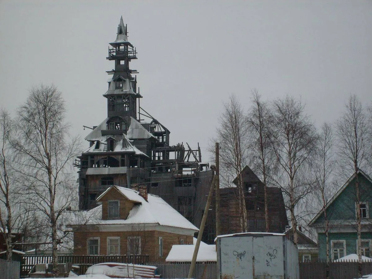 The Sutyagin House, the world's tallest wooden house, is 14 stories tall and covered in snow. 