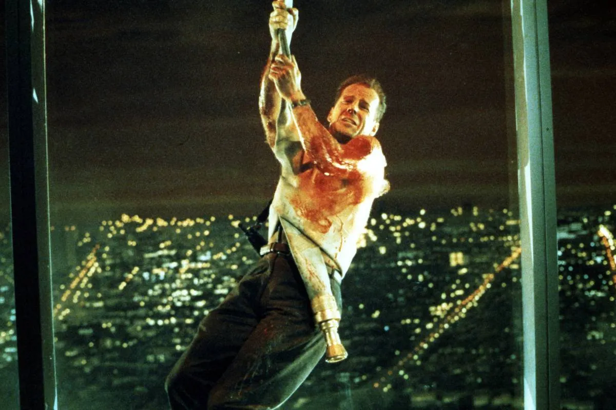 bruce willis swinging from a rope in die hard