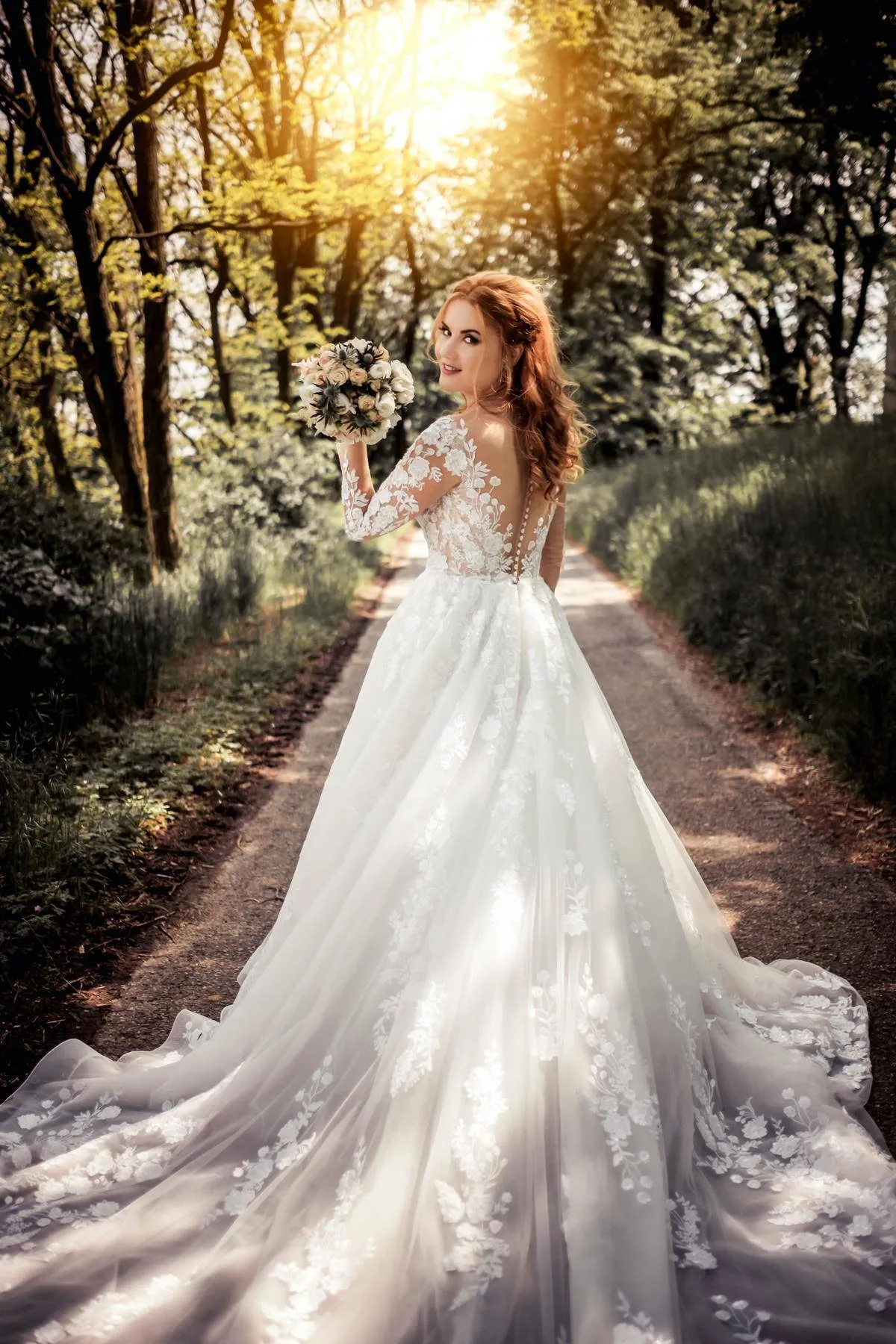 Bride walks through the forest and looks back at the camera 