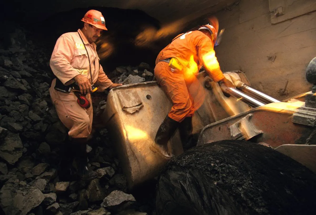 Miners search the Premier Cullinan Mine for diamonds.