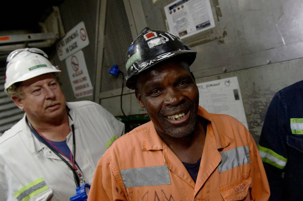 Miners from South Africa descend into the Cullinan Mine.