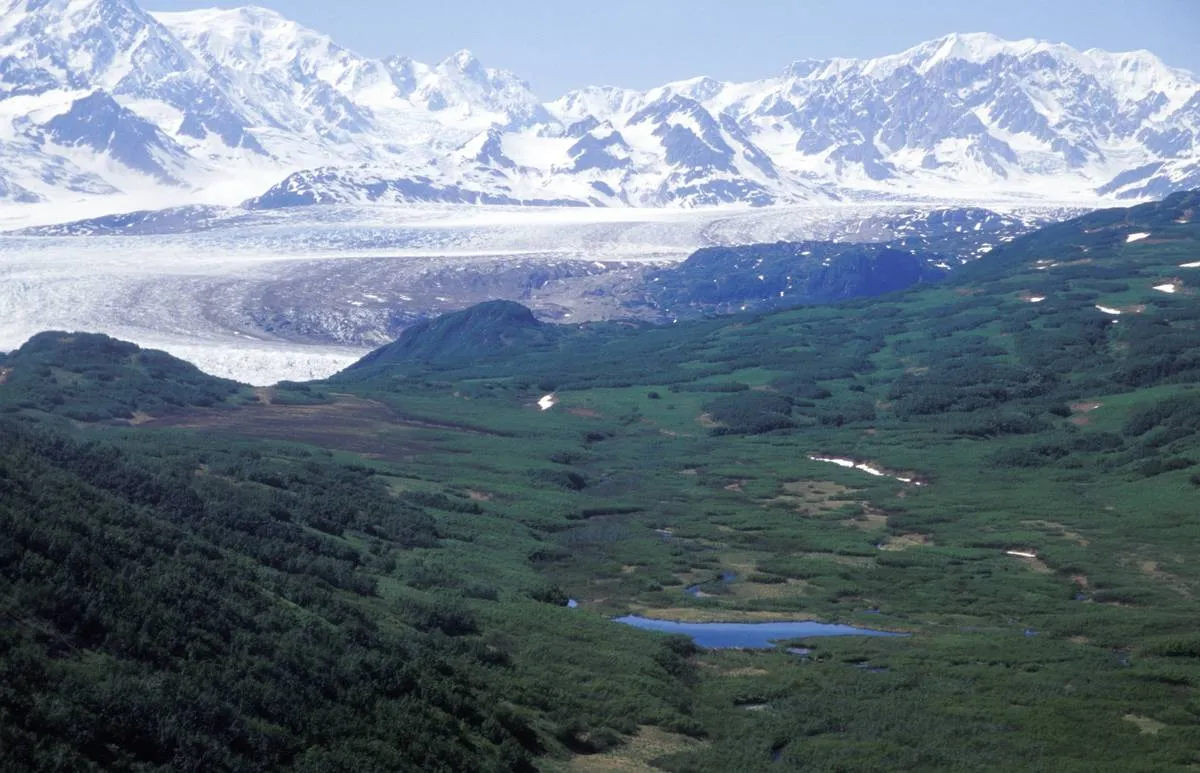 A view of The Triumvirate Glacier in Alaska is from a helicopter.