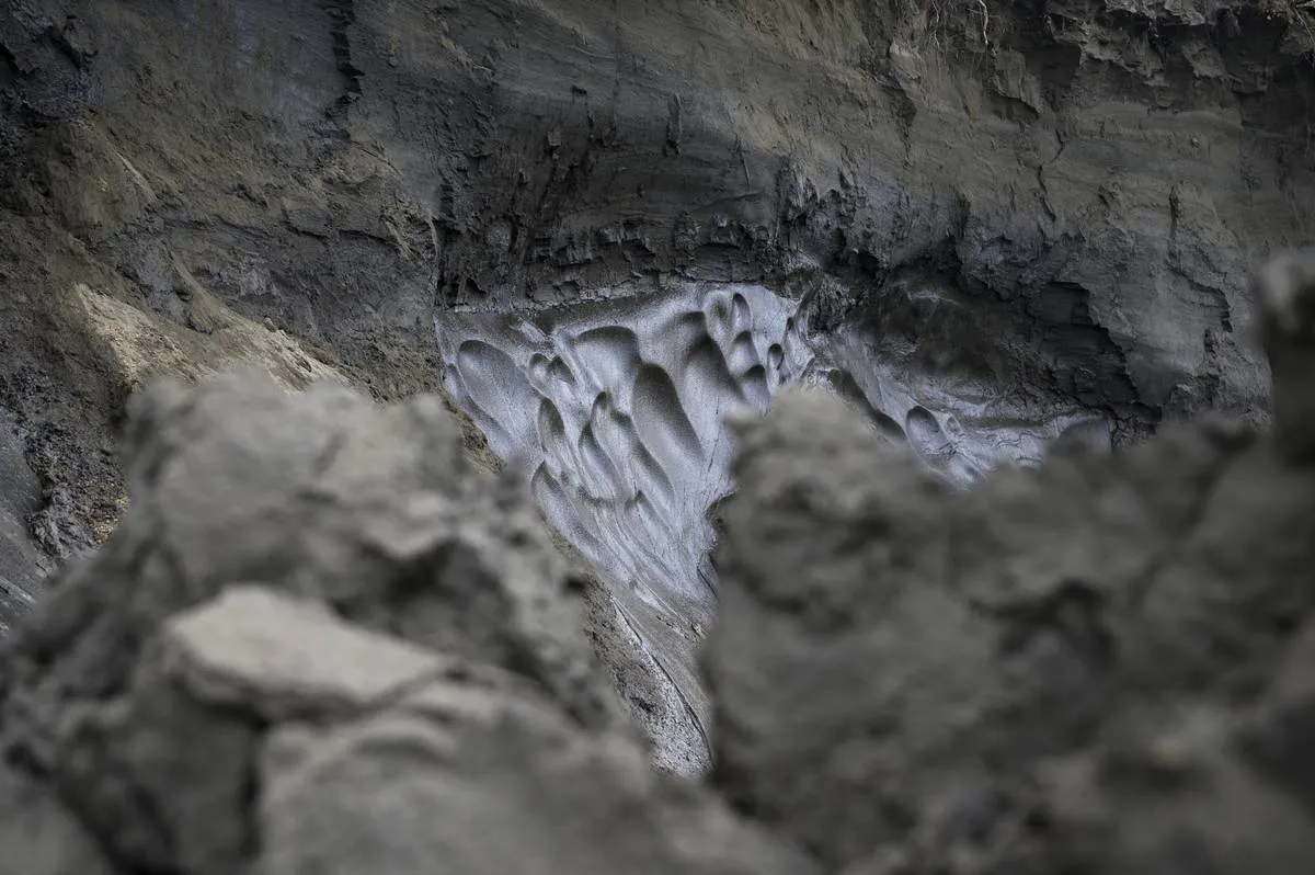 An open spot in a cliff reveals permafrost.