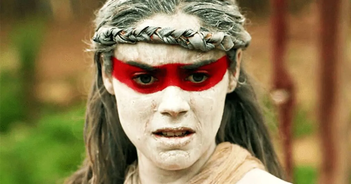 person with face paint in the green inferno