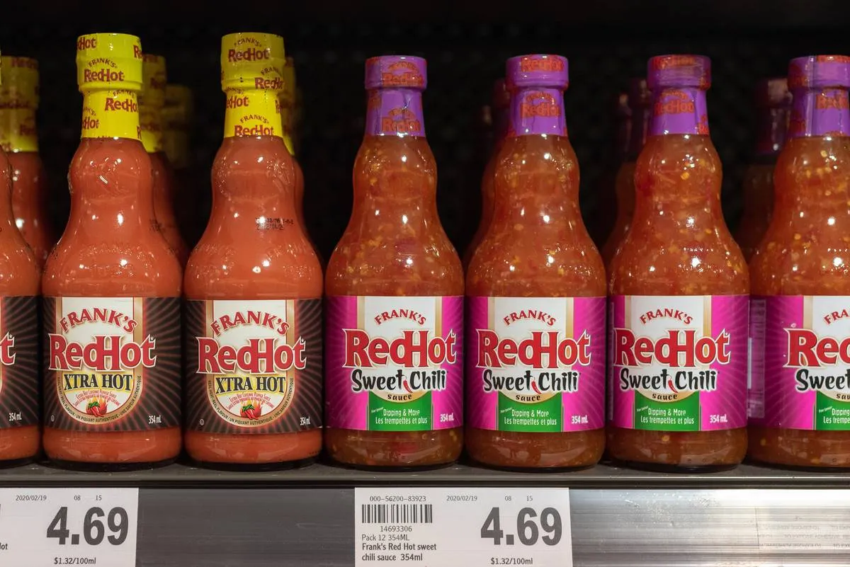 Bottles of Frank's RedHot Xtra Hot and Sweet Chili on a...