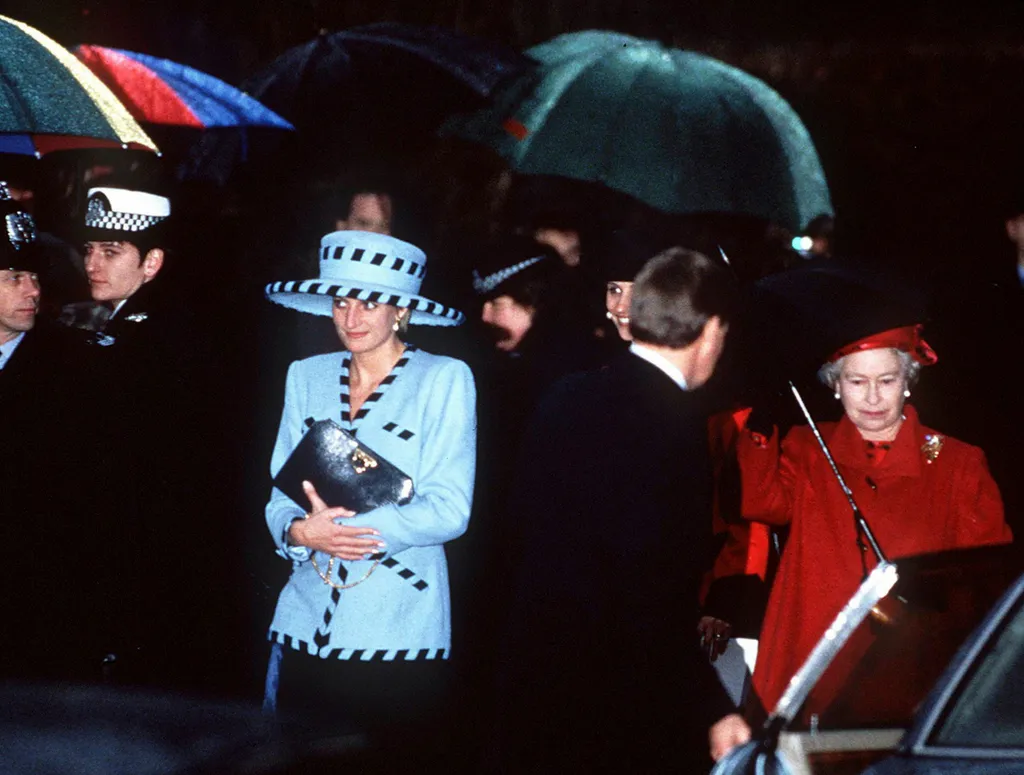 Princess Diana clutches purse to chest next to Queen Elizabeth II