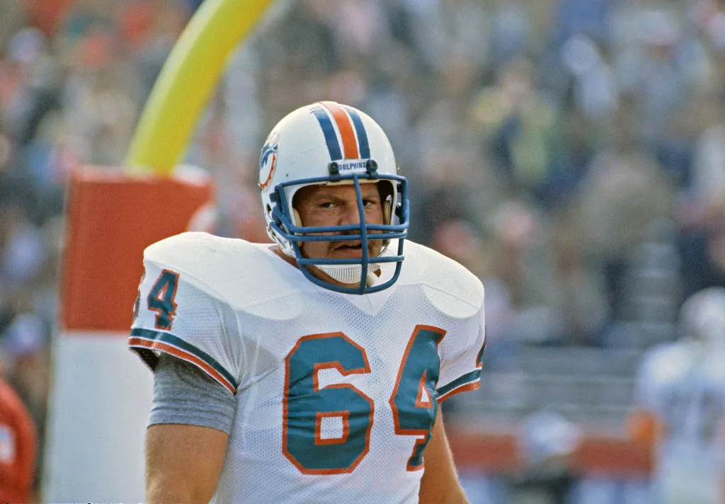 Offensive lineman Ed Newman #64 of the Miami Dolphins looks on from the field before the start of Super Bowl XIX
