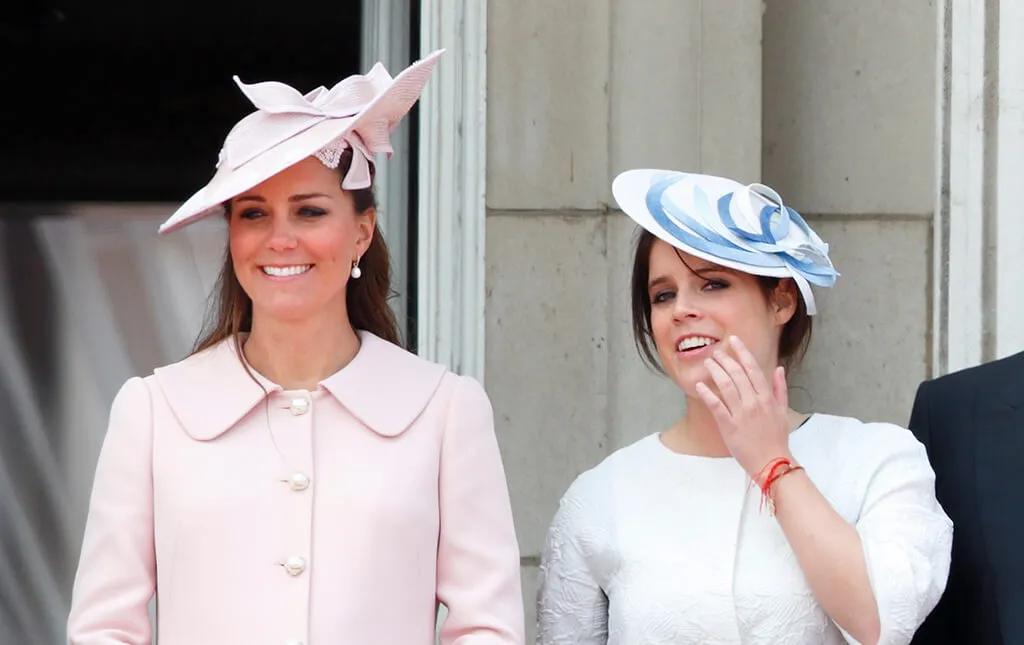 Kate Middleton and Princess Eugenie on balcony wearing hats