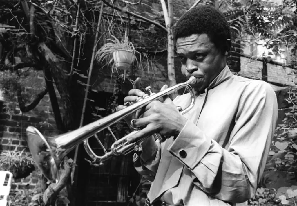 Hugh Masekela plays trumpet/horn instrument
