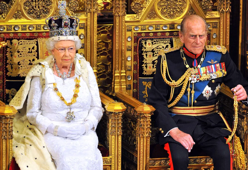 Queen Elizabeth and husband Philip sit on royal throne 