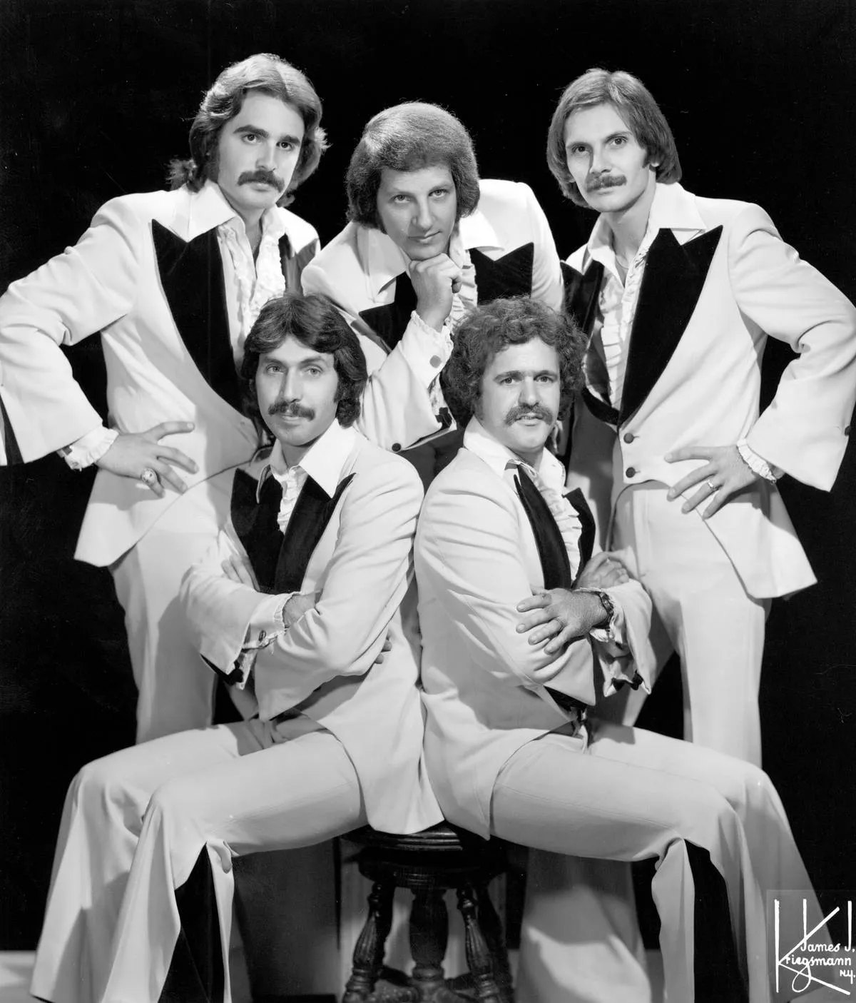 CIRCA 1972: Singer Johnny Maestro poses for a portrait with the members of his band 