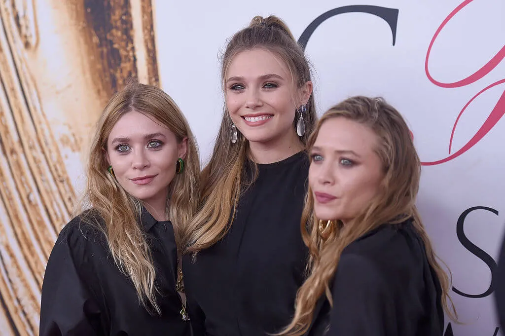 Mary Kate, Elizabeth, and Ashley Olsen at event