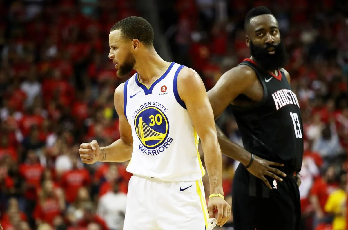 HOUSTON, TX - MAY 28: Stephen Curry #30 of the Golden State Warriors reacts as James Harden #13 of the Houston Rockets looks on in the third quarter of Game Seven of the Western Conference Finals of the 2018 NBA Playoffs at Toyota Center on May 28, 2018 in Houston, Texas. NOTE TO USER: User expressly acknowledges and agrees that, by downloading and or using this photograph, User is consenting to the terms and conditions of the Getty Images License Agreement. 
