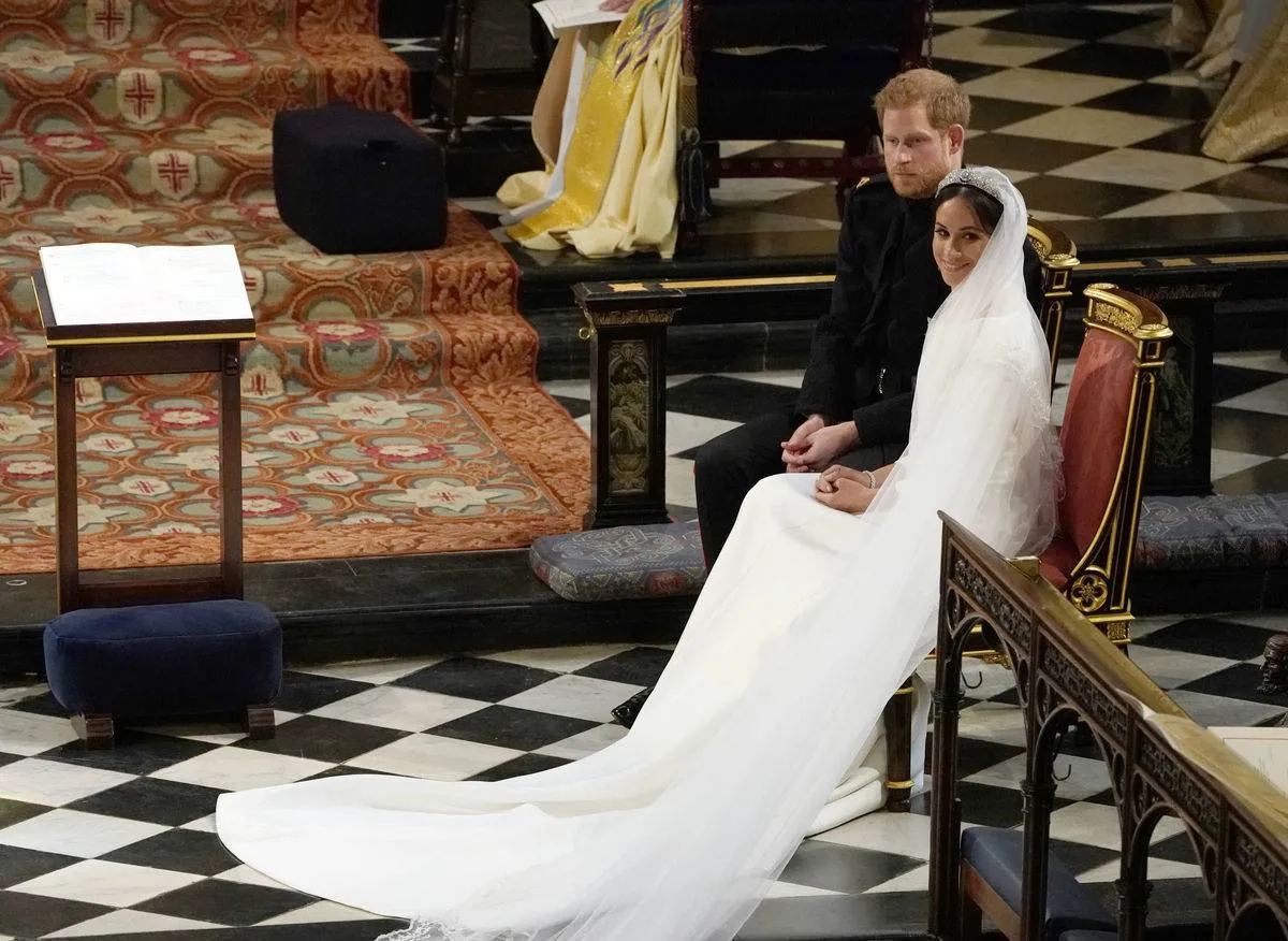 WINDSOR, UNITED KINGDOM - MAY 19: Prince Harry and Meghan Markle during their wedding ceremony in St George's Chapel at Windsor Castle on May 19, 2018 in Windsor, England.