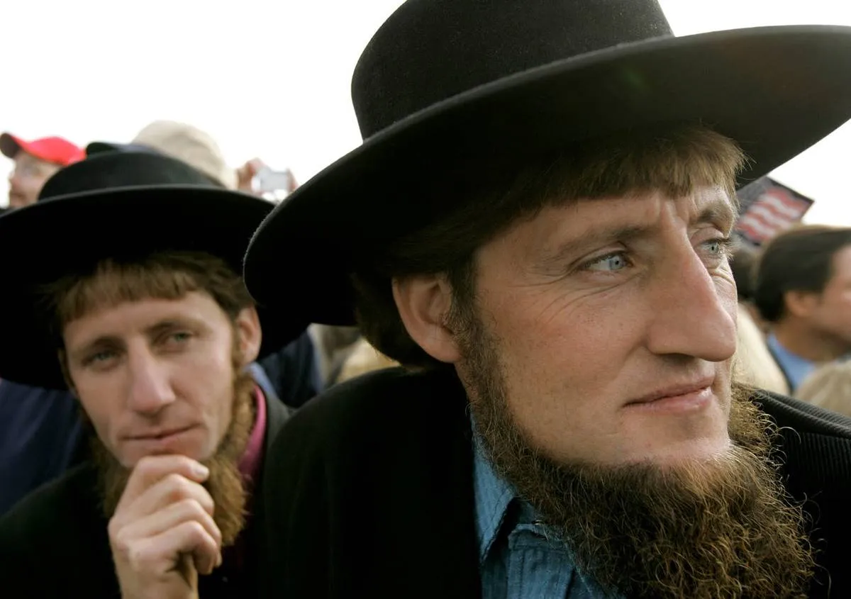 LANCASTER, PA - OCTOBER 27: Two Amish men listen to U.S. President George W. Bush speak to supporters during a campaign rally at Lancaster Airport October 27, 2004 in Lancaster, Pennsylvania. Polls show that Bush is in a neck and neck race with his challenger, Democratic presidentail nomminee Sen. John Kerry (D-MA), with less than a week to go before the November 2 election.