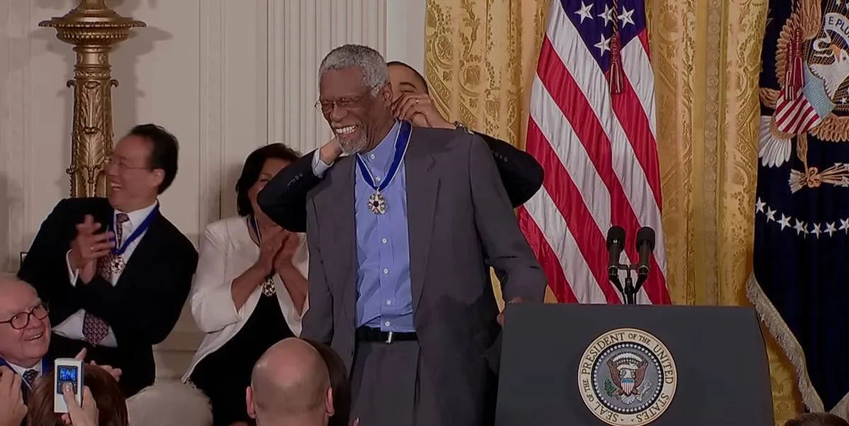 President Barack Obama placing medal around Bill Russell's neck in Bill Russell Legend