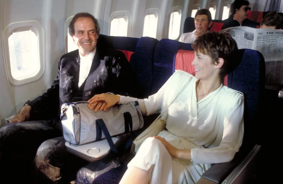 man and a woman on a plane in a fish called wanda