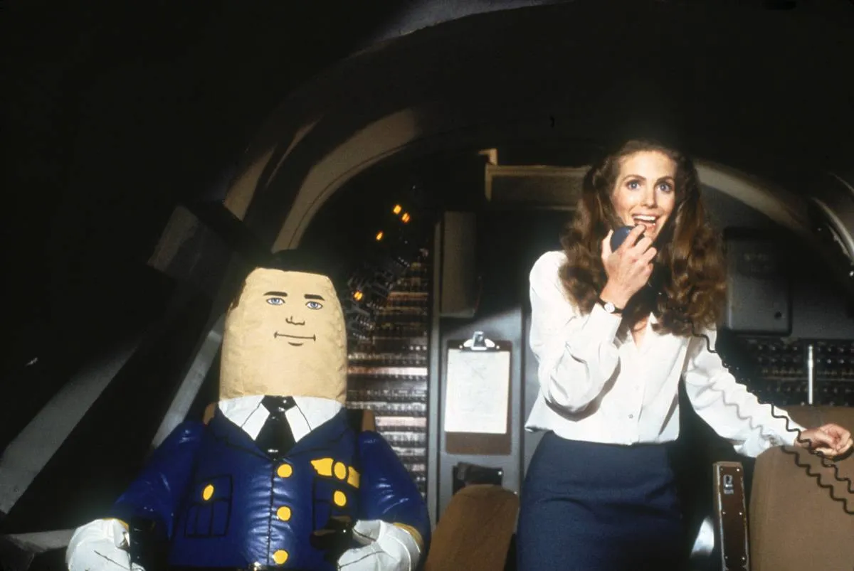 a blow up doll and a flight attendant in airplane