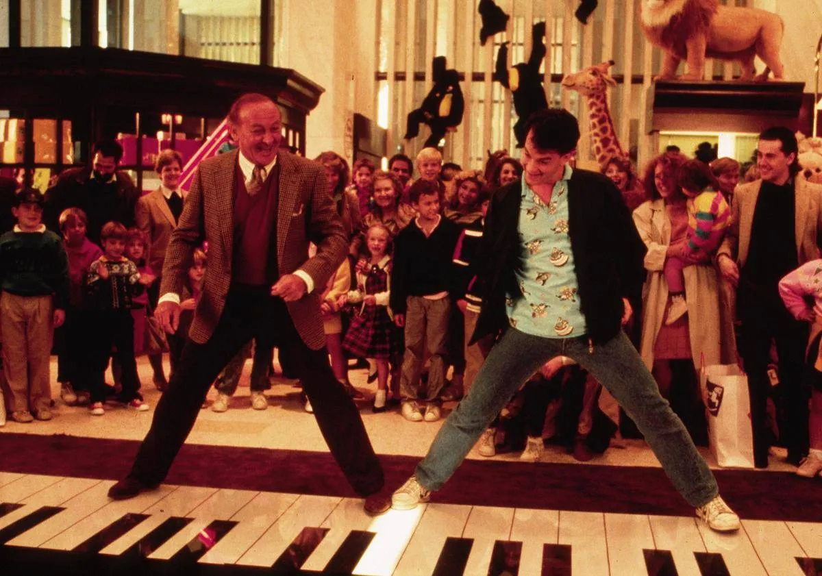 tom hanks dancing on a giant piano in big