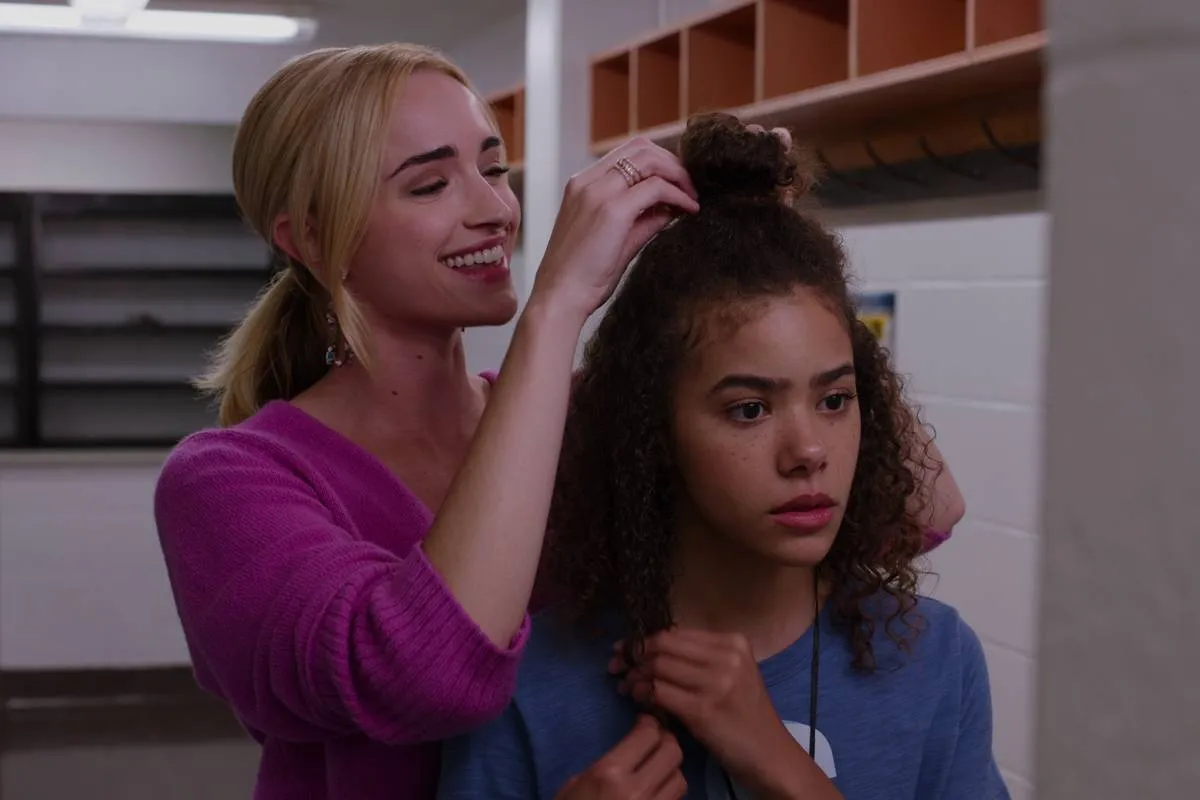 woman fixing girl's hair on ginny and georgia