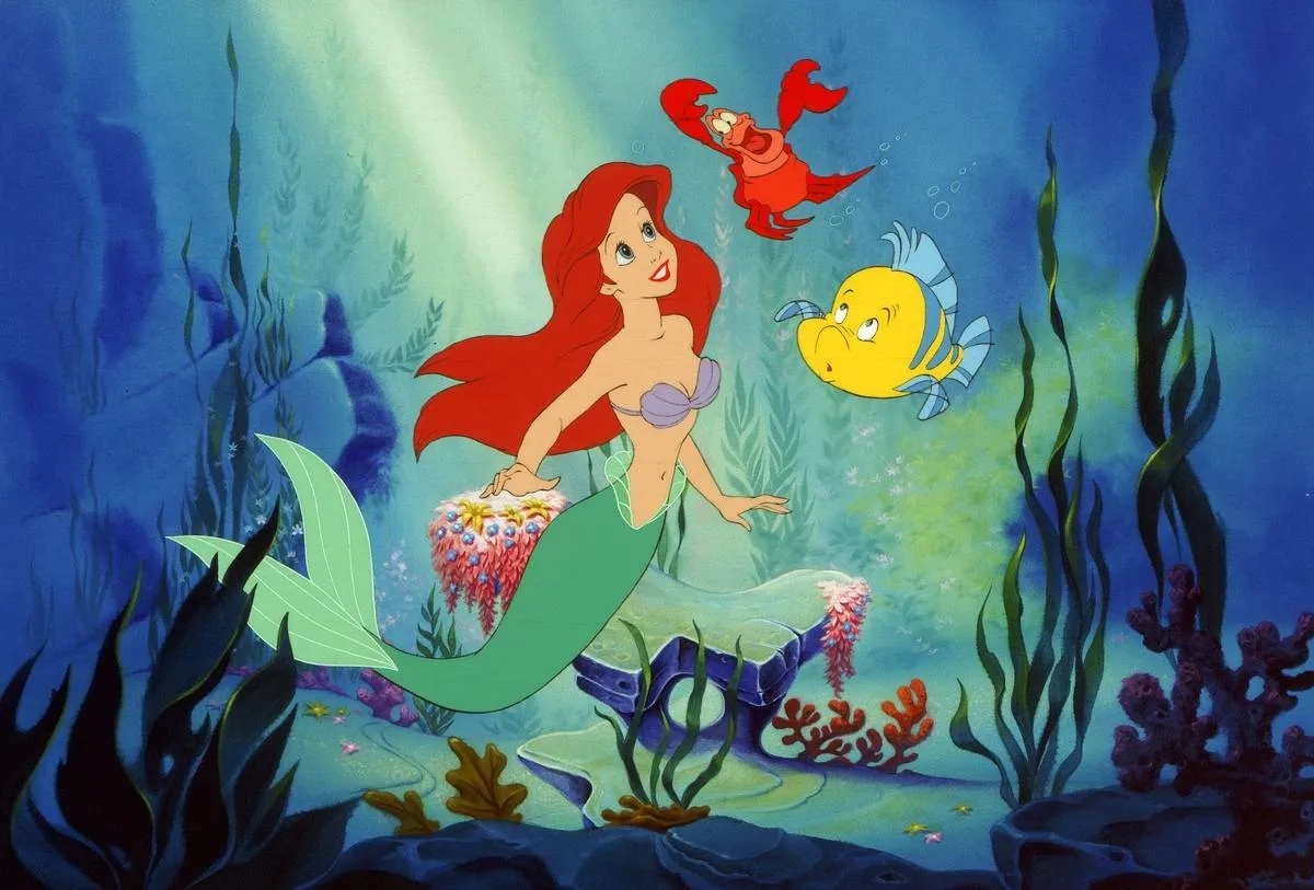 Ariel, Sebastian, and flounder under the sea in the little mermaid