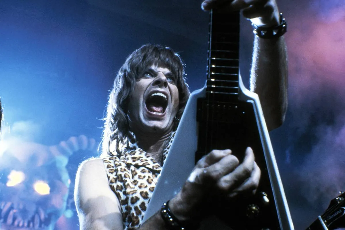 rock star playing electric guitar in this is spinal tap