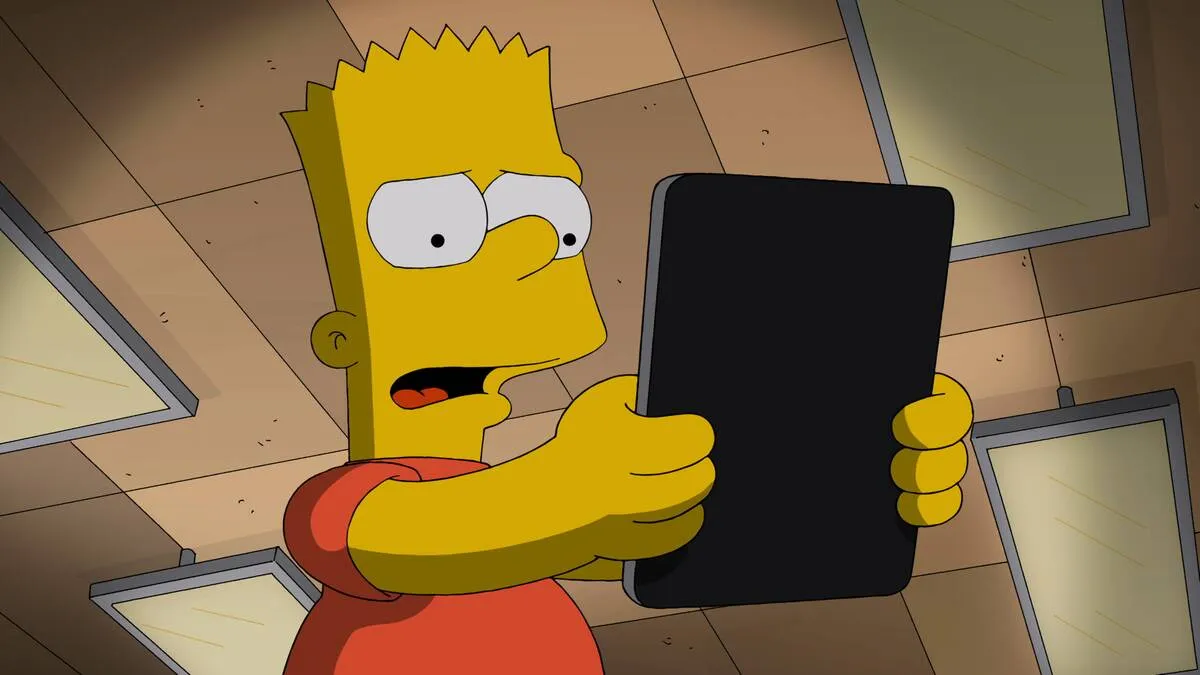 Bart Simpson looking at tablet in horror in The Simpsons
