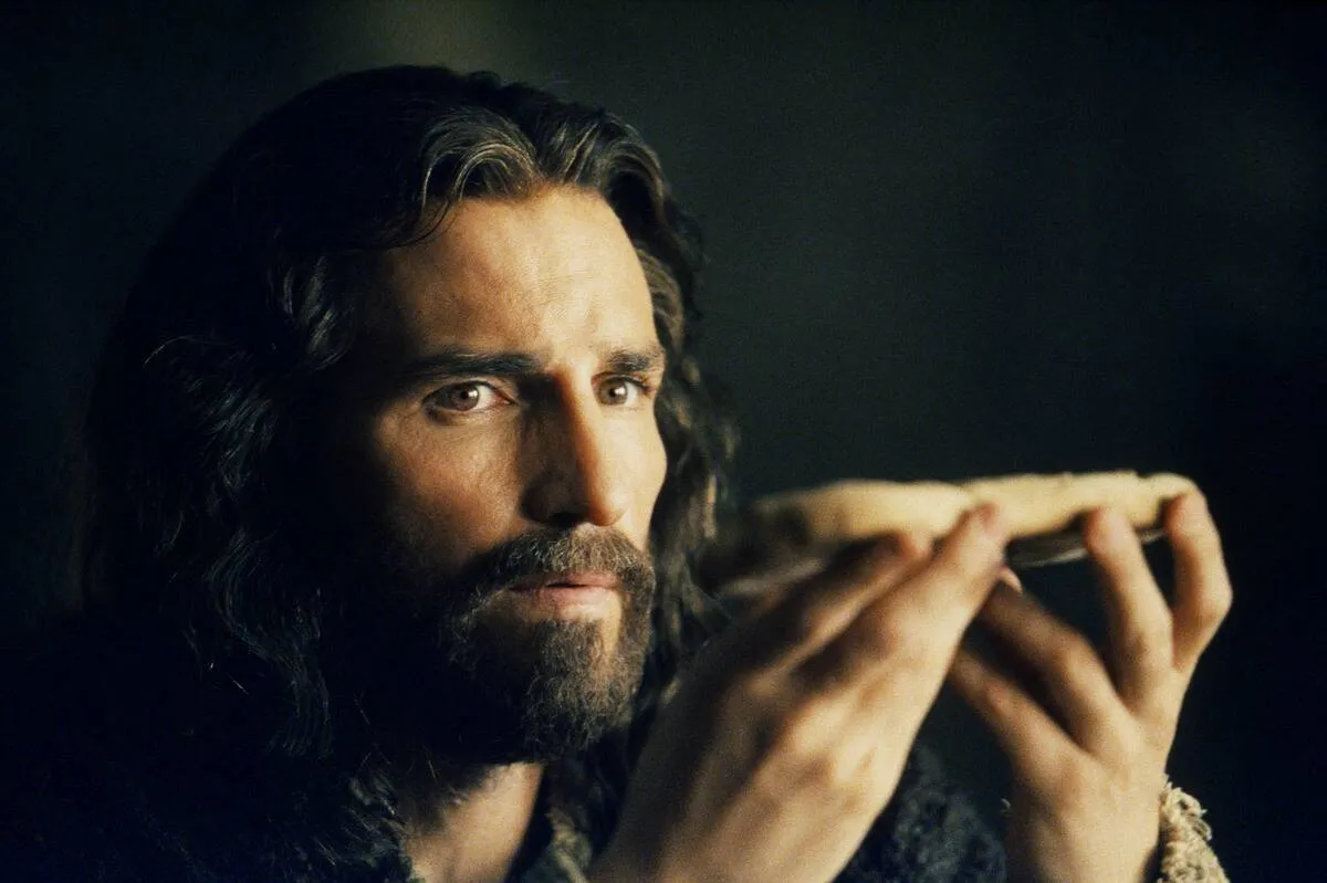 Jim Caviezel holding bread as Jesus in The Passion Of The Christ