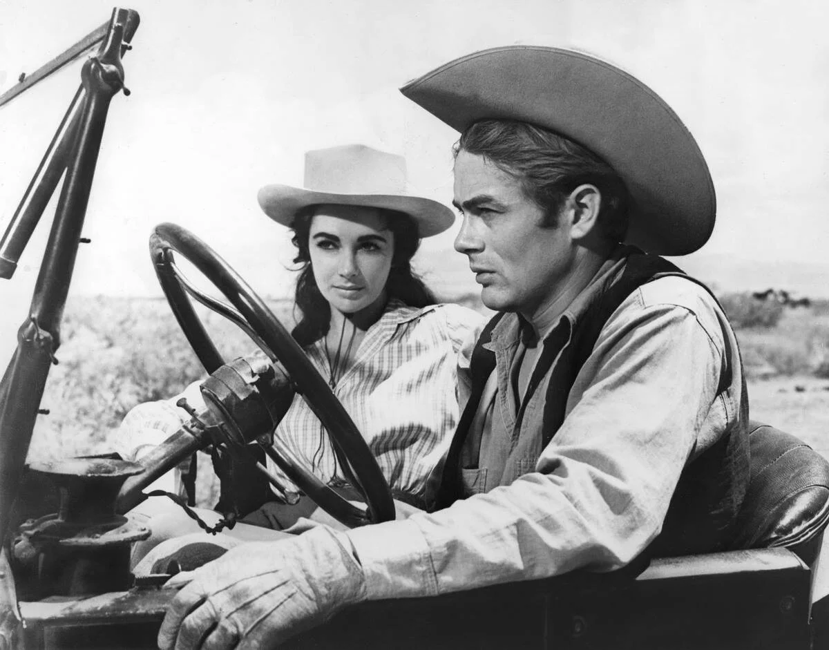 James Dean and Elizabeth Taylor sitting in car in [redacted]