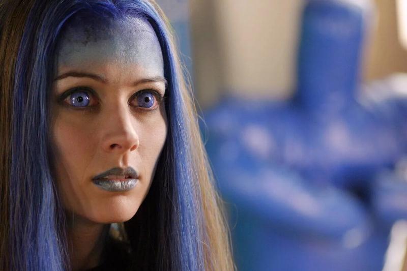 angel girl with purple makeup and hair in angel