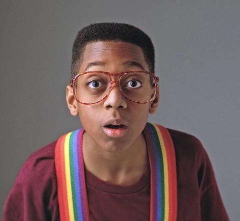 steve urkel wearing rainbow suspenders and glasses on family matters