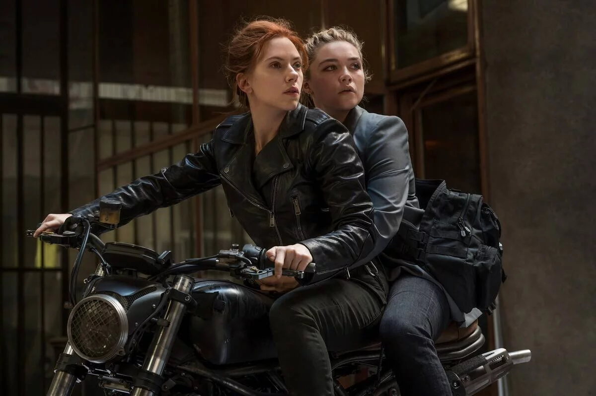 scarlett johansson and florence pugh on a motorcycle